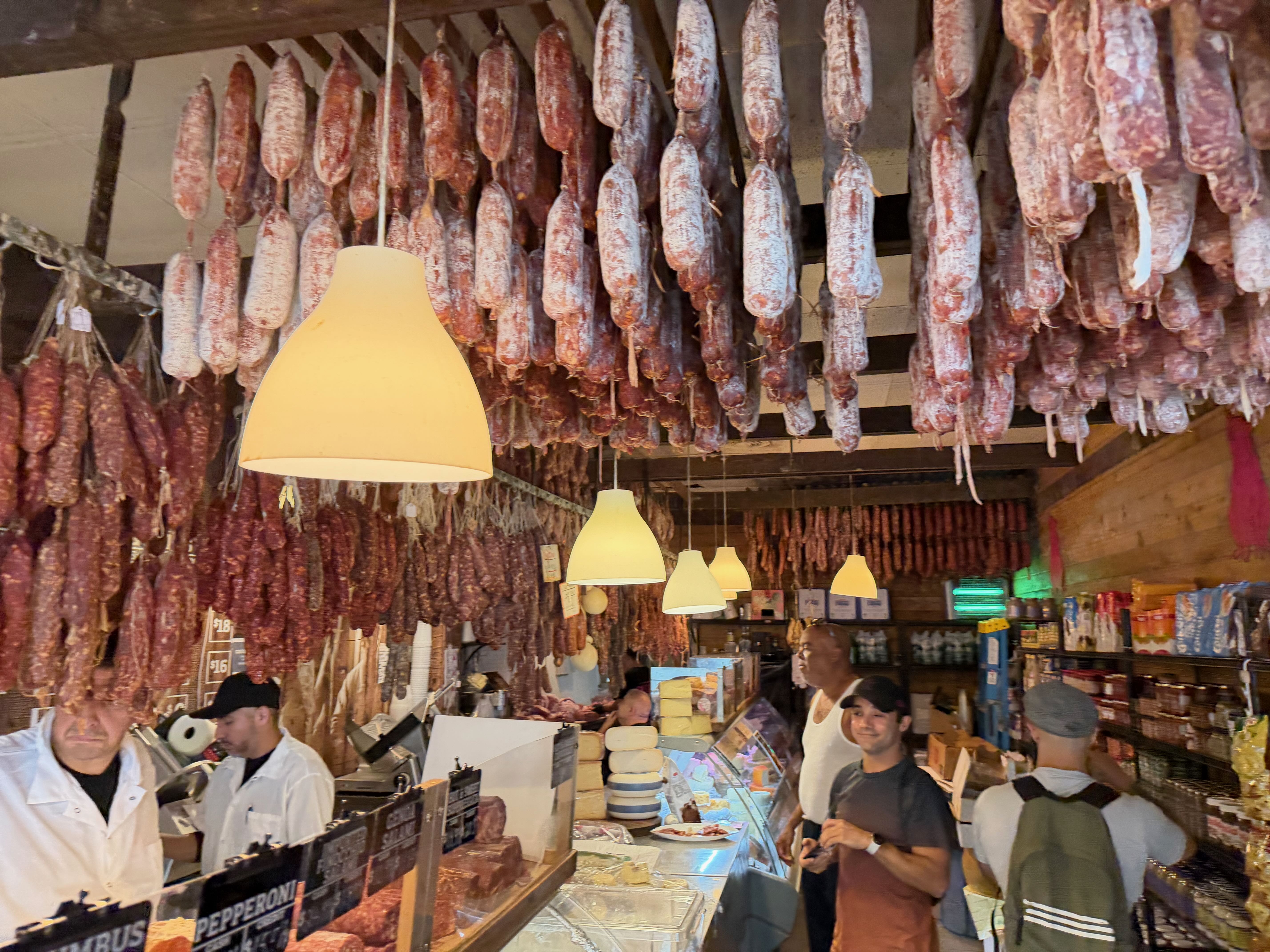 The meat chandelier at the Calabria Pork Store.